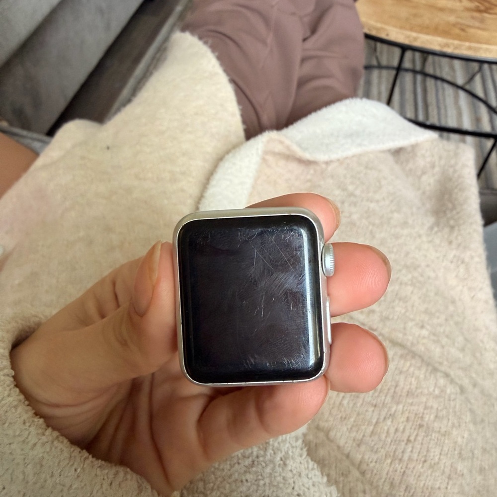 Apple Smartwatch with Black Display and Silver Casing